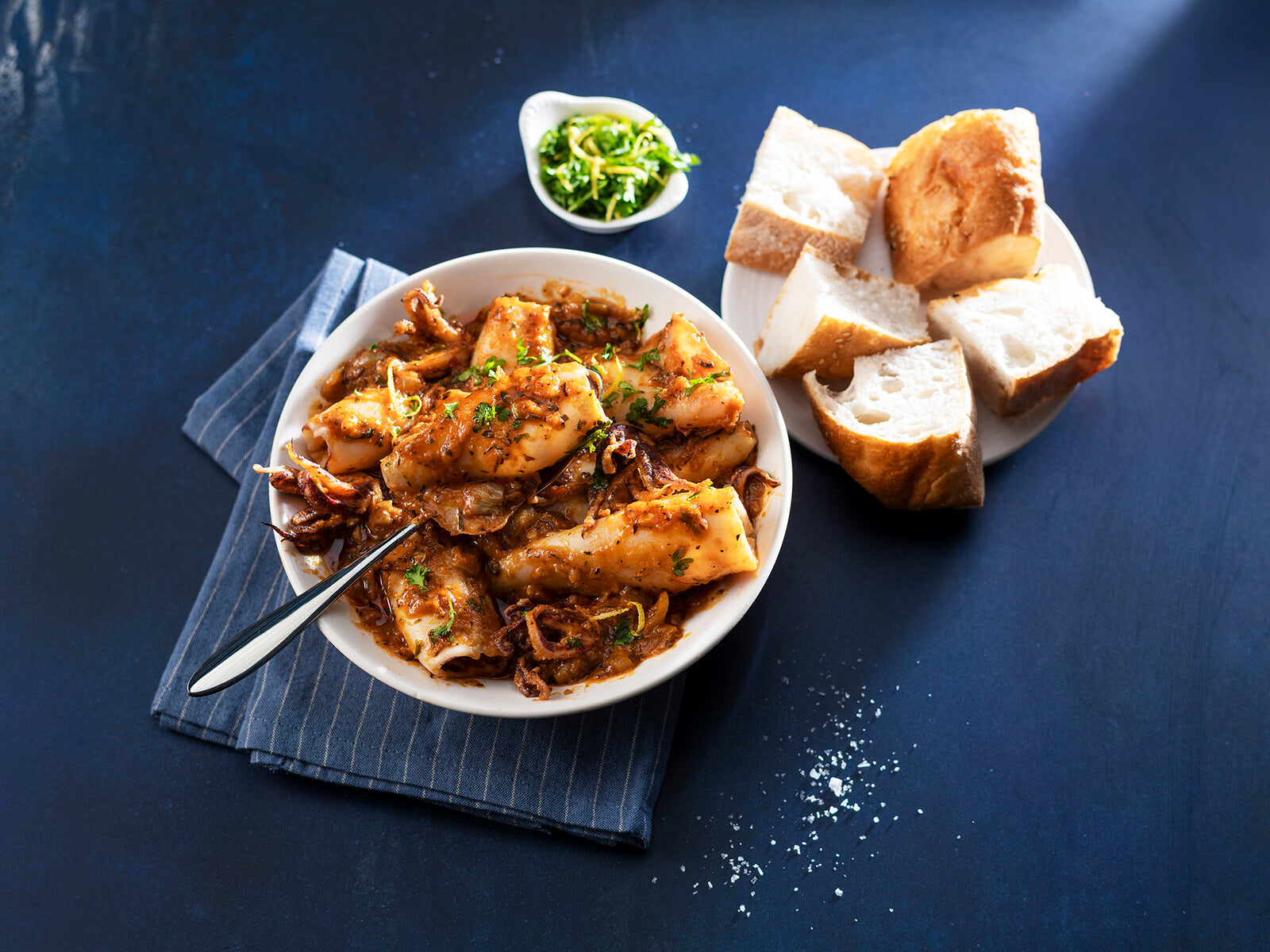 Pijlinktvisstoof met ansjovis ‘à la ossobuco’